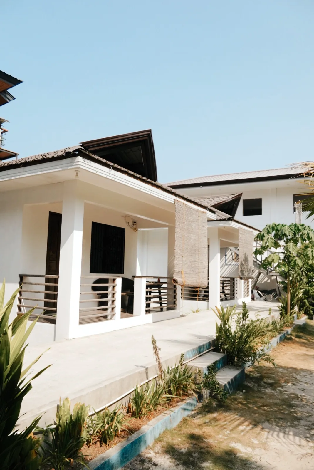 Exterior of a Double Room with Terrace showing the covered terrace and entrance.