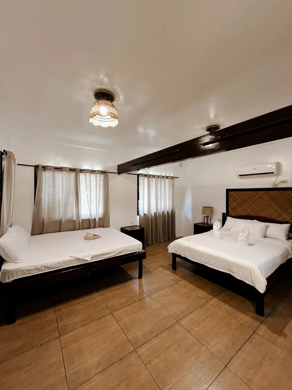 Wide interior view of the Beachfront Bungalow showing its sleeping area.