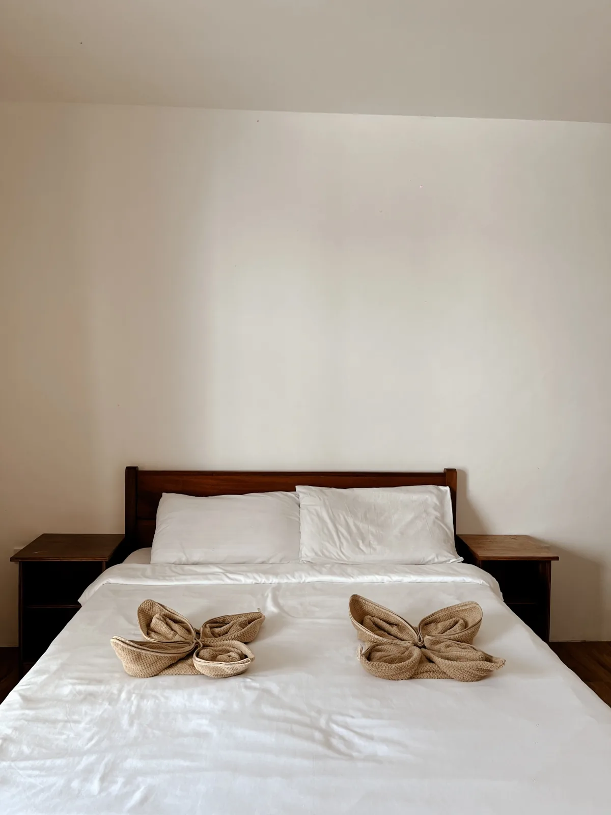 Wide view of the Standard Room with Queen-size bed and air-conditioning.